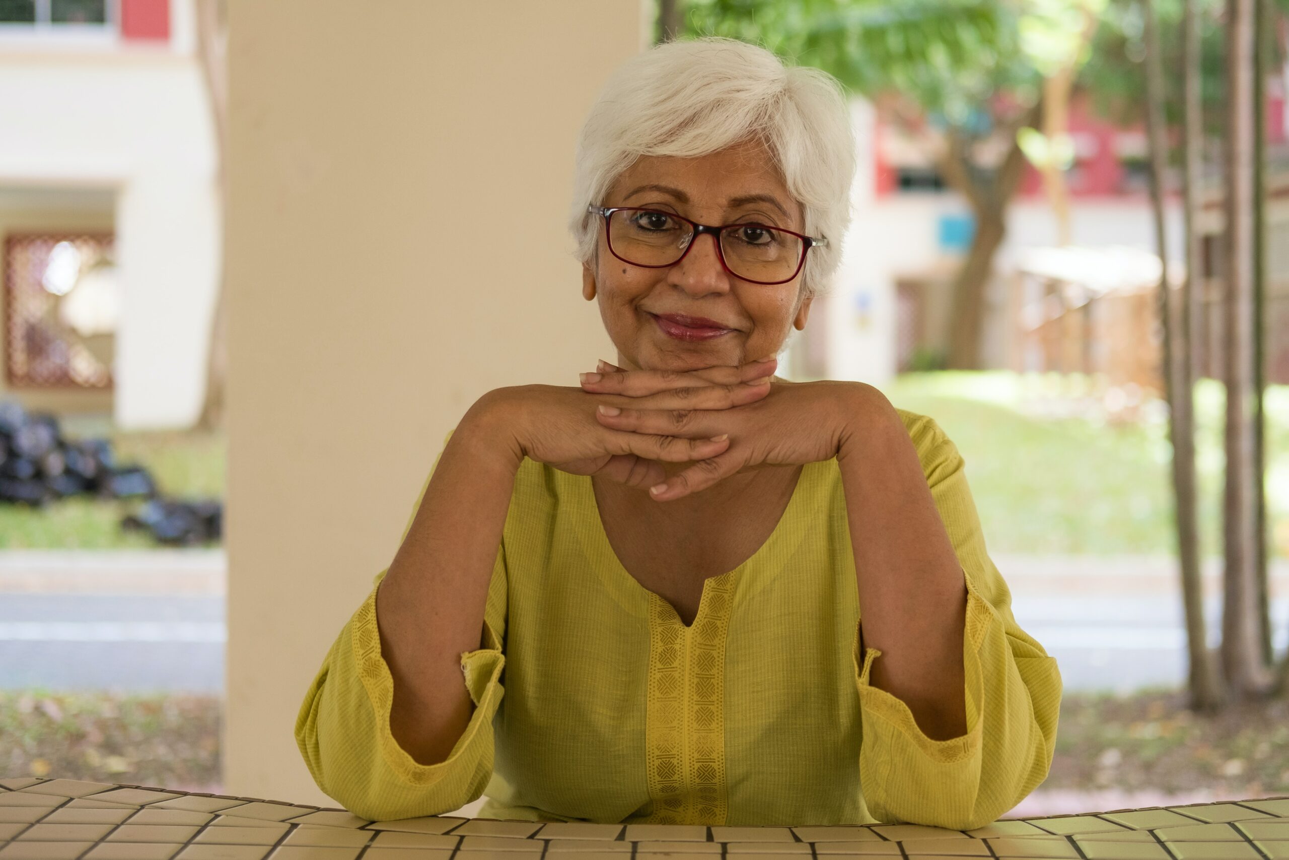 older woman sitting at a table